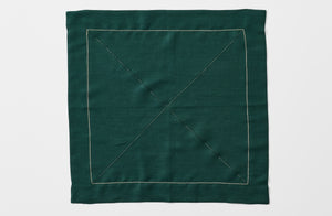 Bottle green linen Peter Speliopoulos hemstitch napkin.