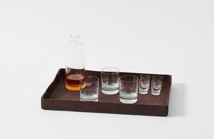 Peter Speliopoulos chestnut leather large rectangle tray with glassware.