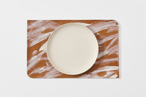 Peter Speliopoulos gesso crackle leather placemat with plate.