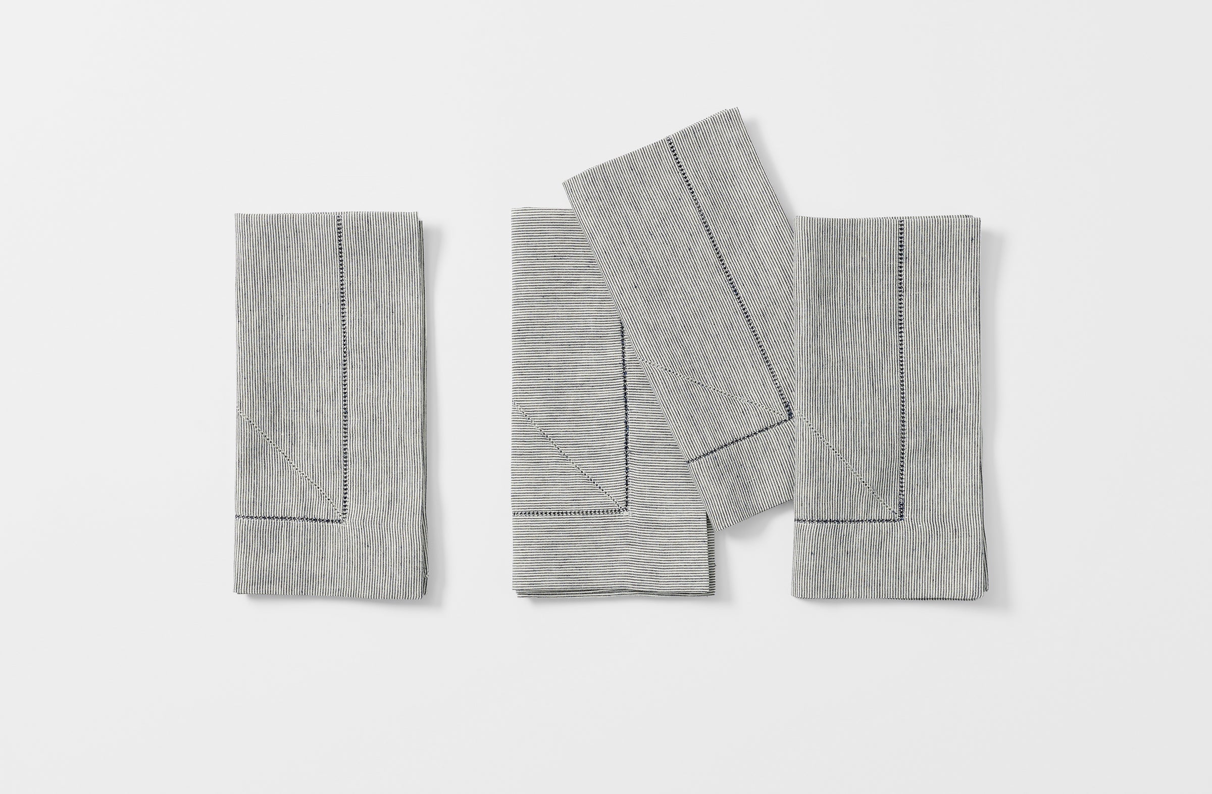 Four Peter Speliopoulos navy ticking stripe linen napkins