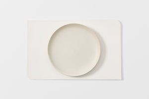 Peter Speliopoulos white rectangle leather placemat.