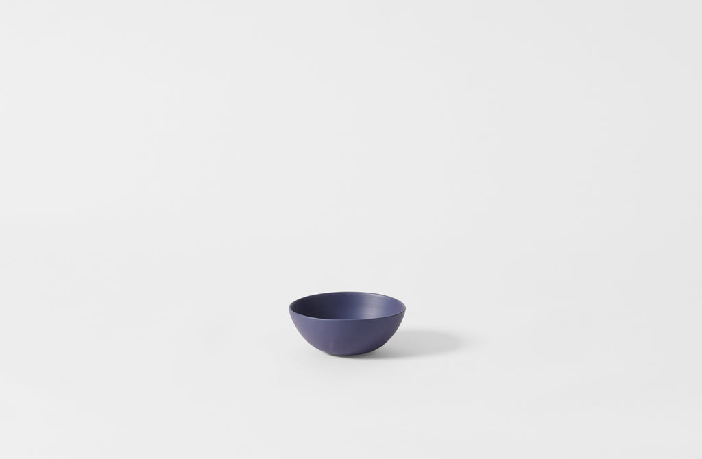 Extra small Rina Menardi blue shallow bowl.