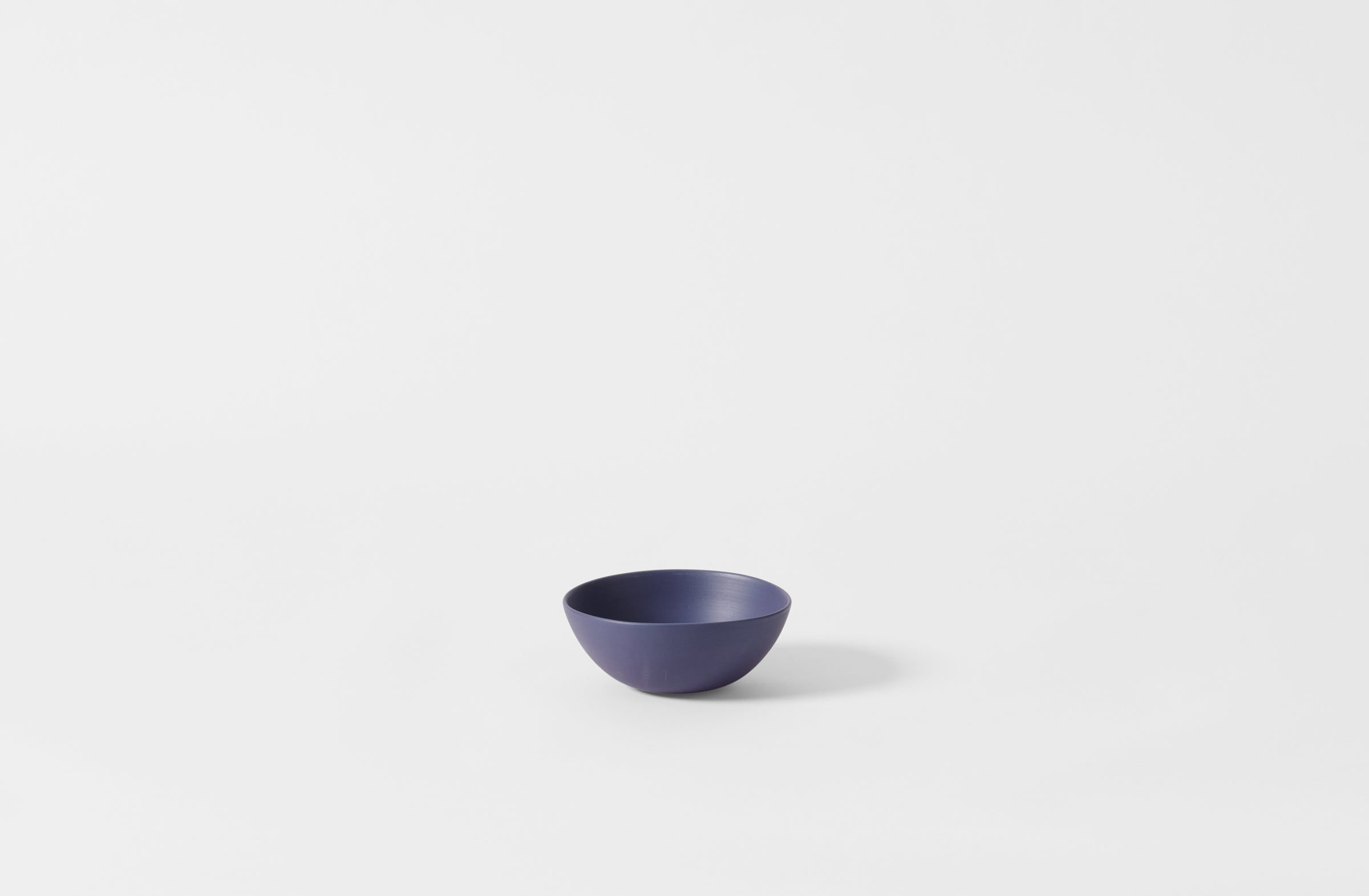 Extra small Rina Menardi blue shallow bowl.
