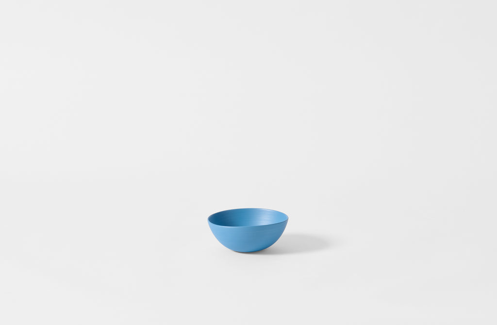 Extra small Rina Manardi turquoise shallow bowl.
