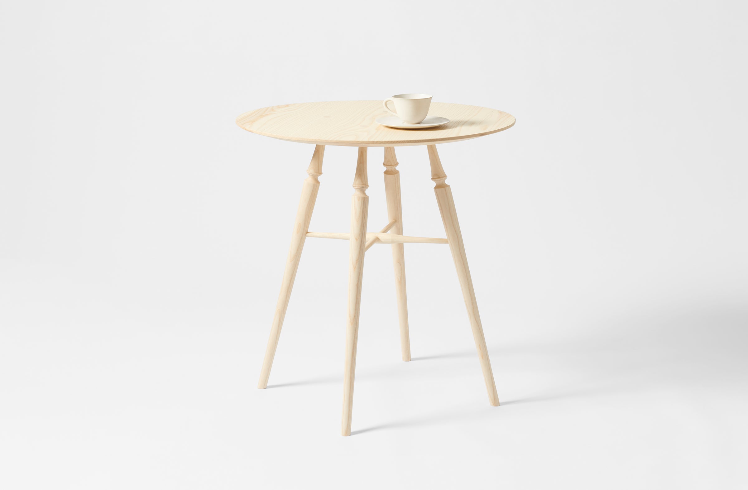 Sawyer Made ash round table with teacup and saucer. 