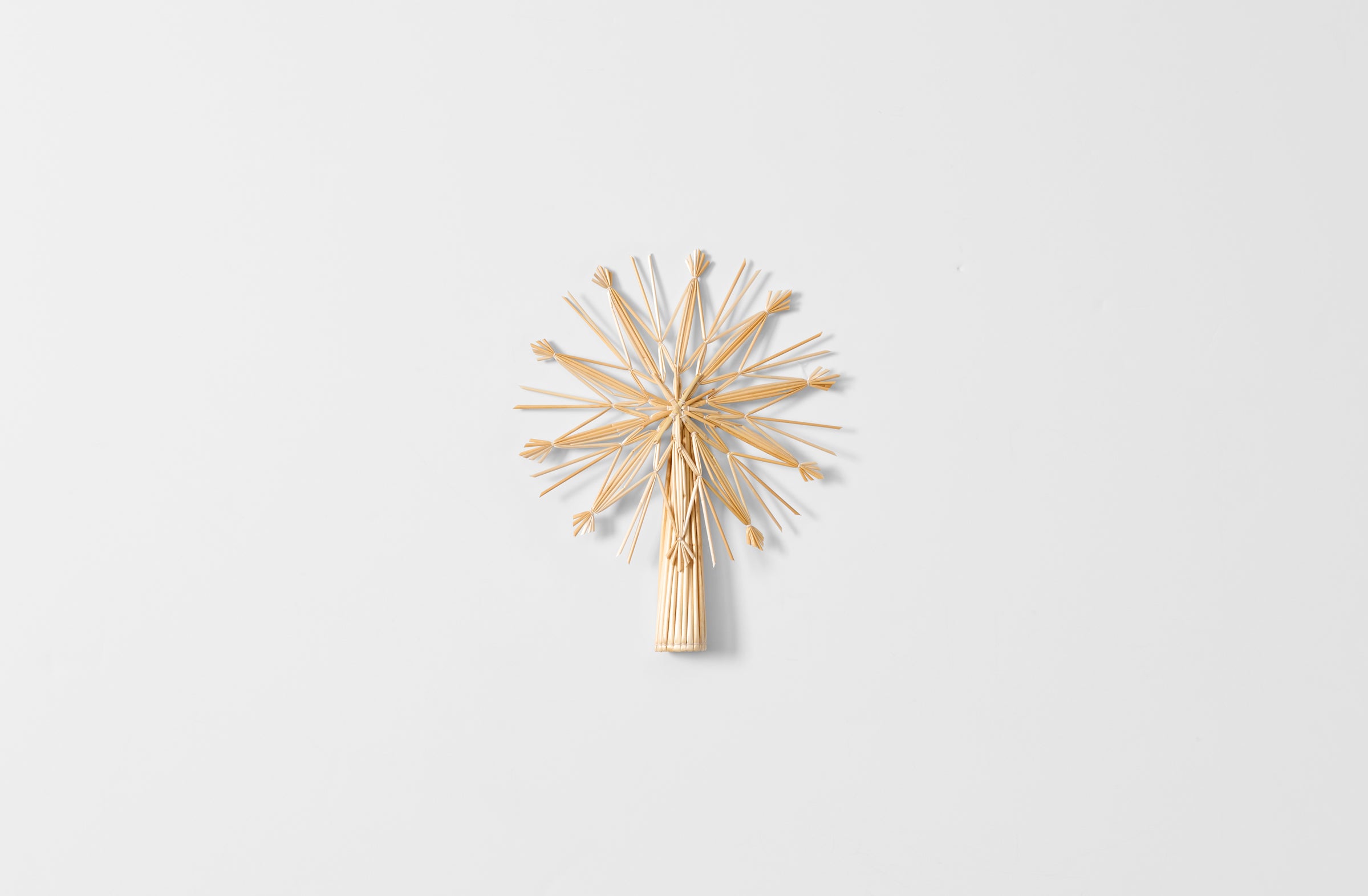 Straw snowflake tree topper.