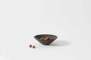 Takashi Endo small black shallow bowl holding chestnuts.