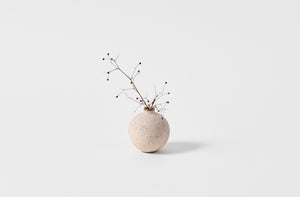 Takashi Endo white bud vase with spray of little berries.