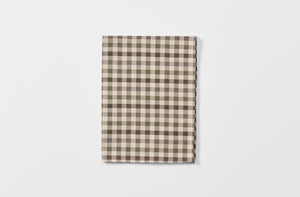 Tori Murphy brown check kitchen towel folded.