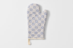 Folded Tori Murphy indigo tapestry oven mitt.