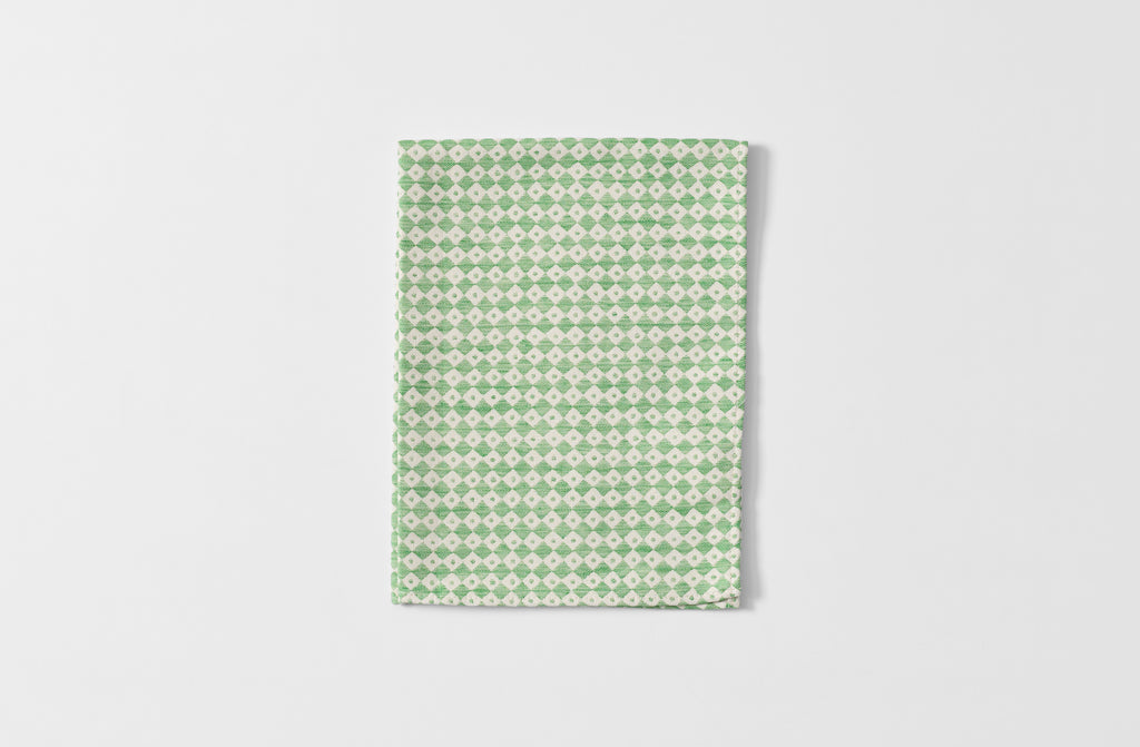 Folded Tori Murphy spruce check kitchen towel.
