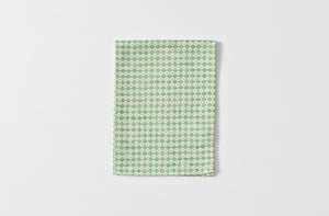 Folded Tori Murphy spruce check kitchen towel.