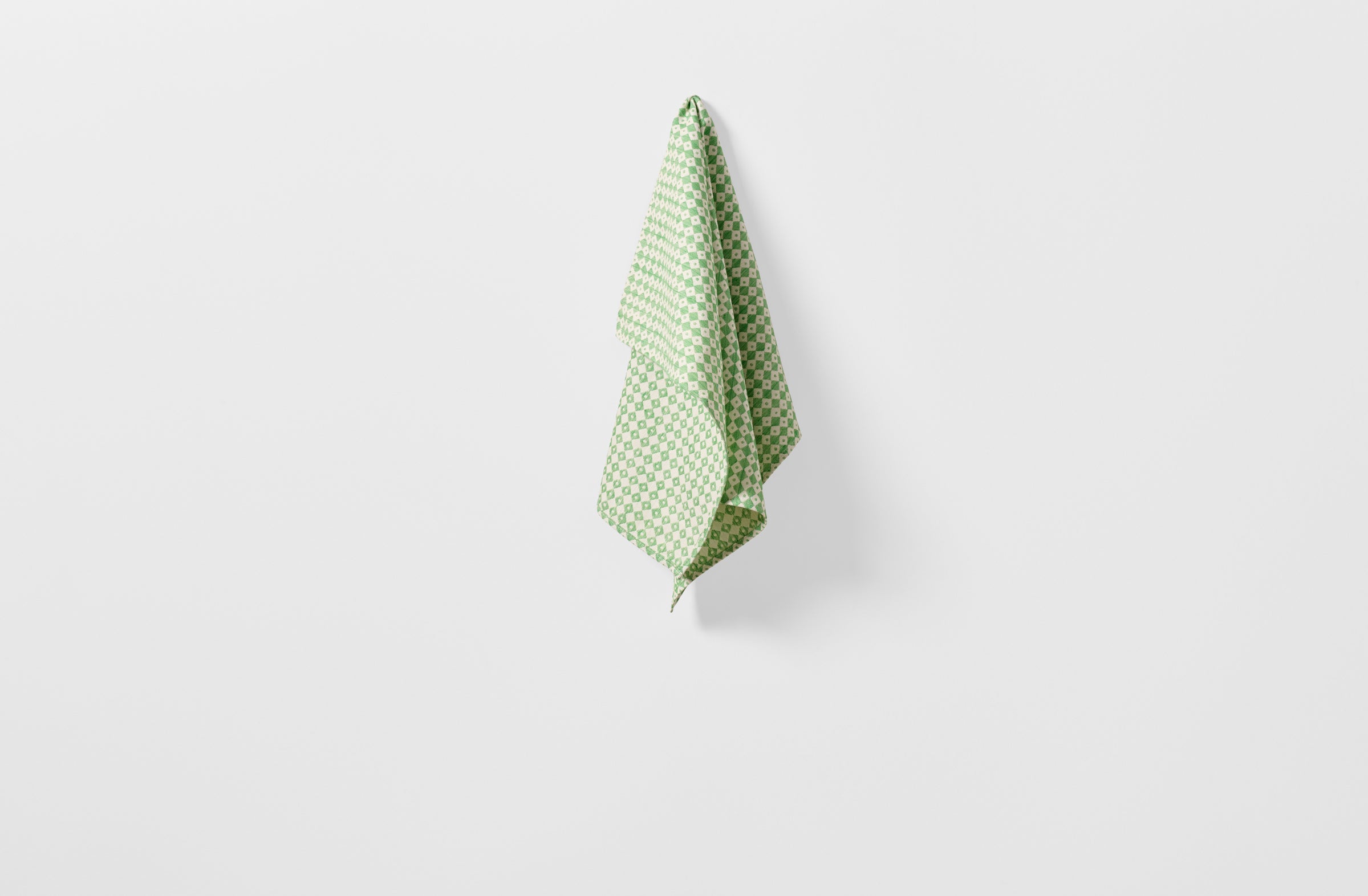 Tori Murphy spruce check kitchen towel hanging.