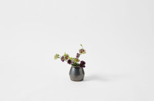 Tracie Hervy graphite petite vase holding flowers