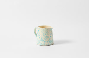 Turquoise and cream large splatterware pitcher.