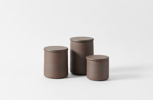 Trio of Victoria Morris brown clay canisters in small medium and large.