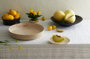 Abigail-Castaneda-Wood-Vessels-with-yellow-fruit-and-floral-on-a-striped-Chiarastella-Cattana-tablecloth_P