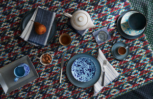 Anita-Le-Grelle-Dinnerware-on-Gregory-Parkinson-Tablecloth-with-Chiarastella-Cattana-striped-napkins-splatterware-and-christiane-perrochon-teapot-and-tray