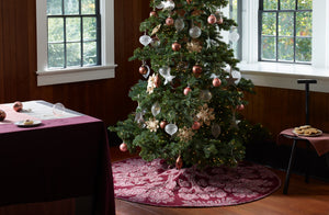 Christmas-Tree-with-Ornaments-and-Hawaiin-Treeskirt-next-to-Faye-toogood-rubberized-spade-chair-set-with-cookies