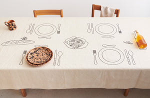 MARCH-black-on-terracotta-splatterware-atop-embroidered-tablecloth-Default