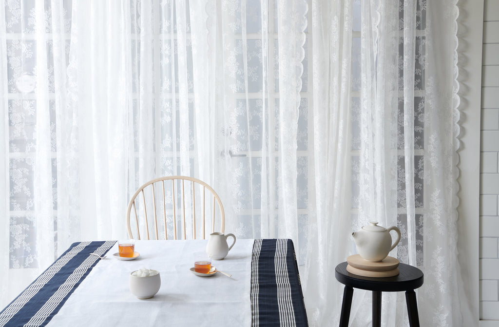 Lobmeyr teacups with Christiane Perrochon tea service in light filled room on table. Default