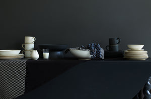 Mixed-Christiane-Perrochon-Dinnerware-in-white-and-slate-on-once-milano-patchwork-linen-runner.