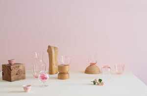 Pink-Lobmeyr-and-Dibbern-glassware-stacked-with-wood-objects-as-a-still-life