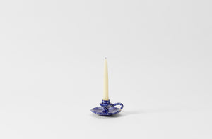 blue on cream splatterware chamberstick candleholder with taper candle
