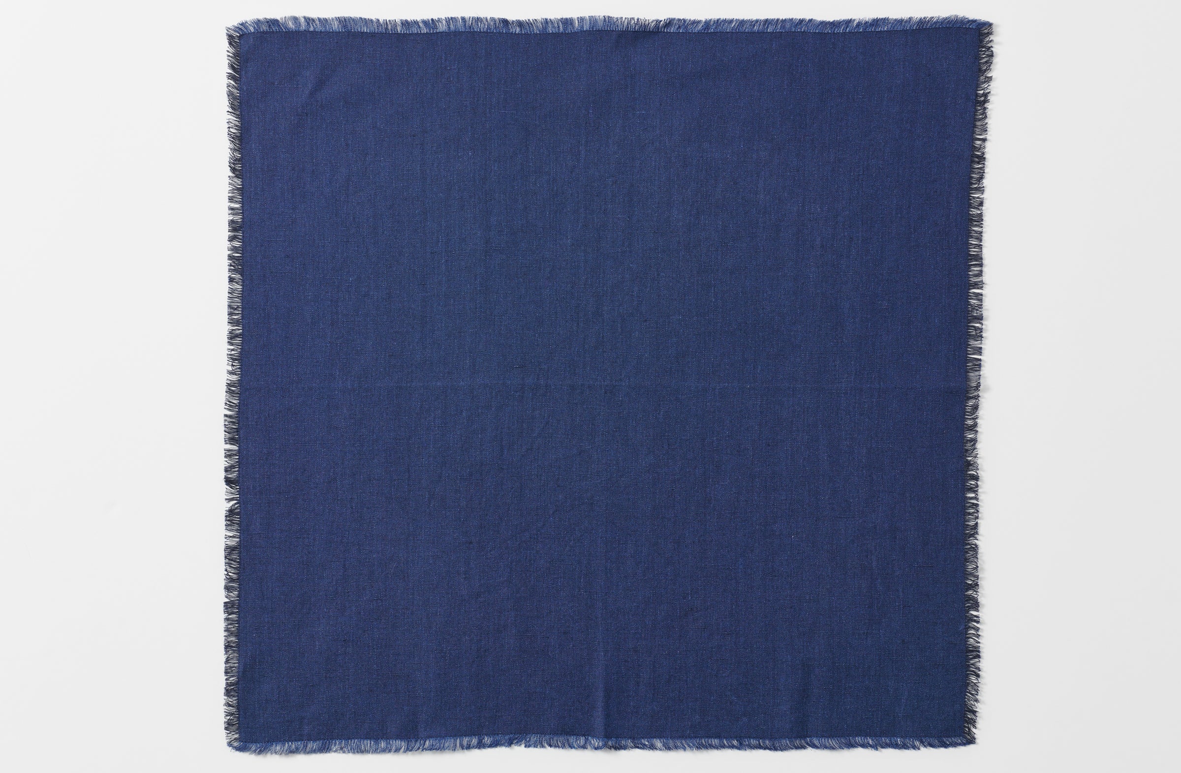 boxwood belgian linen navy fringed dinner napkin shown unfolded