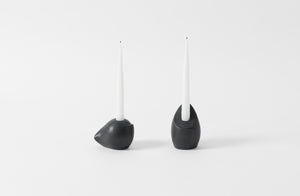 carol leskanic black short and tall sculptural candlesticks set with white taper candles
