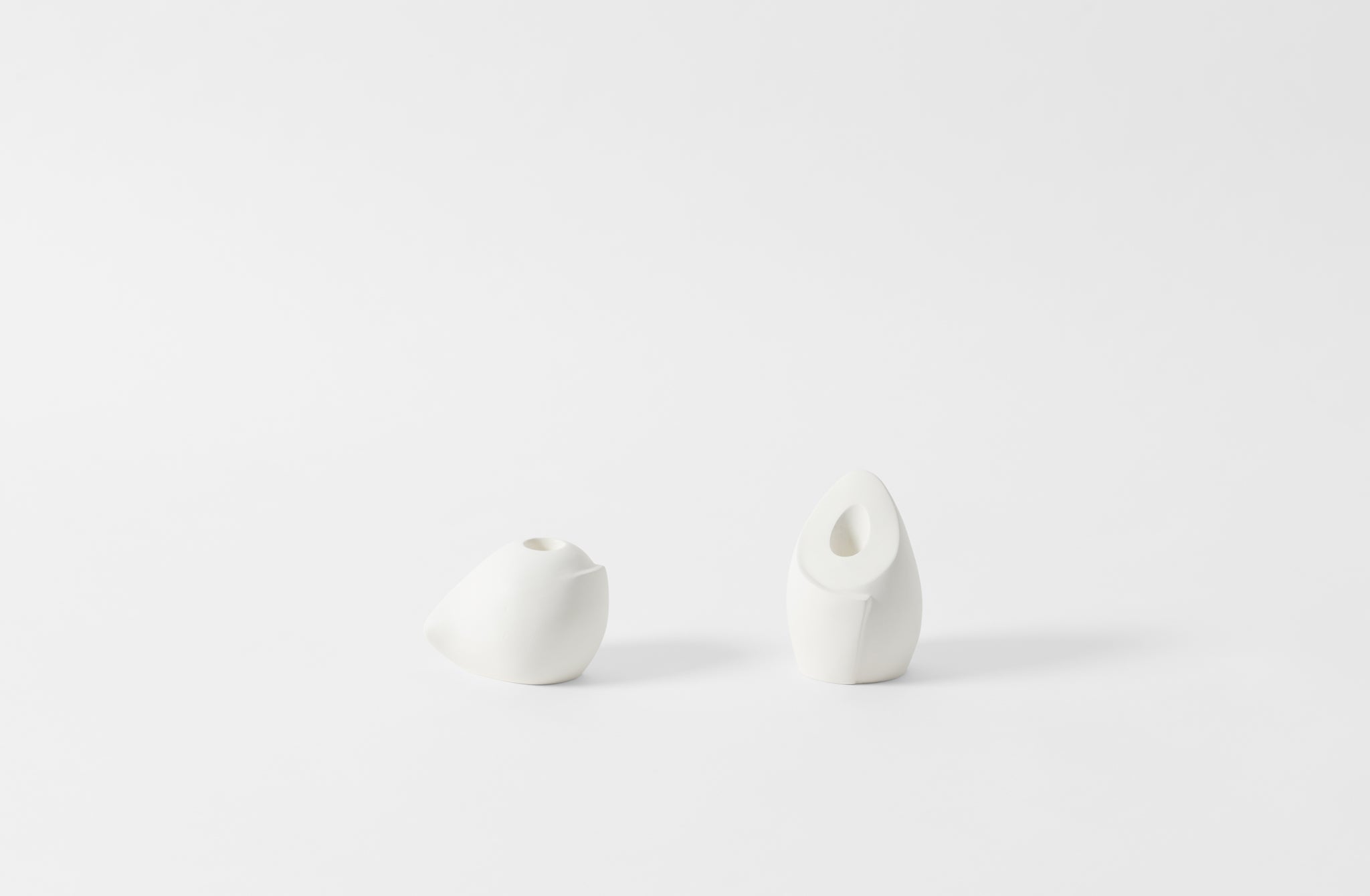 carol leskanic white gesso short and tall sculptural candlesticks