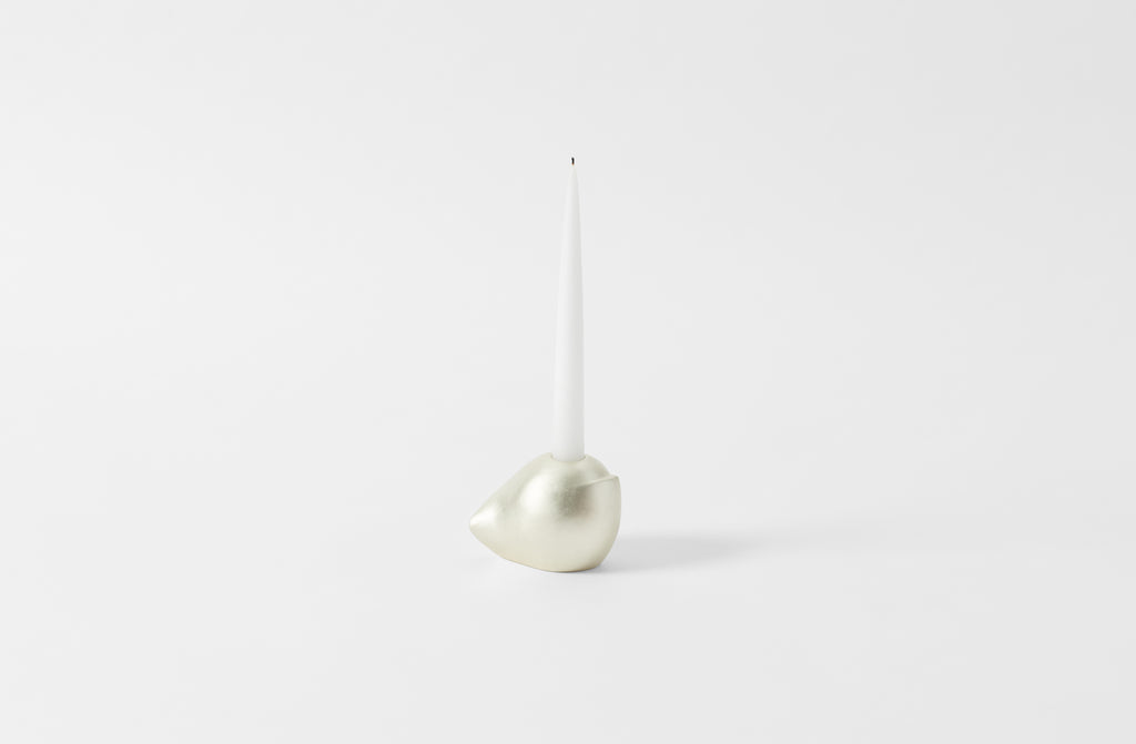 carol leskanic white gold short sculptural candlestick with white taper candle