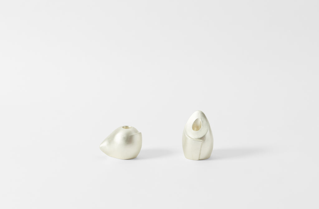 carol leskanic white gold short and tall sculptural candlesticks