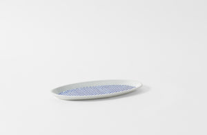 mg by hand hand painted checkered oval porcelain platter angled view