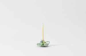 green on cream chamberstick candleholder with taper candle