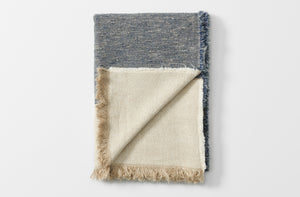 libecco heavy belgian linen north sea stripe throw blanket shown folded with one fringed edge turned up 