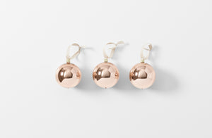 pale copper hand blown glass ball ornaments with linen ribbon loops shown as a set of three
