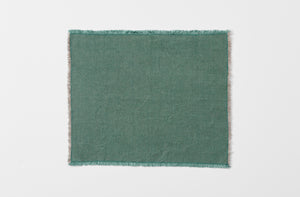spruce hopsack linen placemat with fringe edge shown from overhead