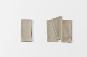 taupe napkin in a set of four
