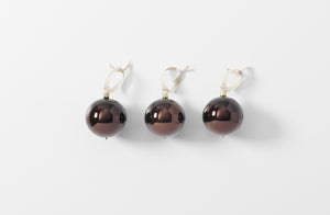 umber hand blown glass ball ornaments with linen ribbon loops shown as a set of three